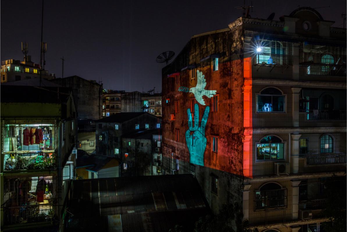 The three-finger salute created by Yangon artists projected on Yangon buildings © Panos Pictures _ Anonymous Myanmar photographer _ Visa d’Or for News winner (Visa pour l’Image Festival) 