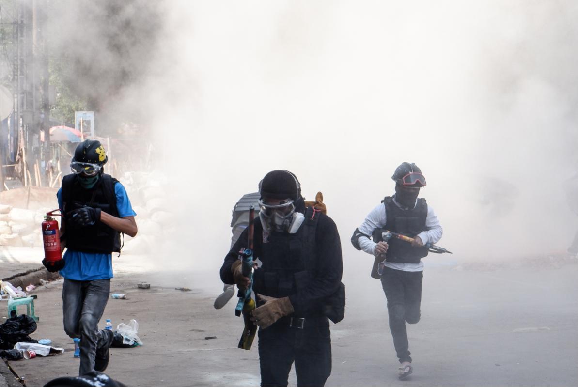 Protesters running away from tear gas © Anonymous Myanmar photographer